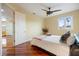 Bright bedroom with hardwood floors and en-suite bathroom access at 7716 Club Ln, Sarasota, FL 34238