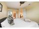 Comfortable bedroom with hardwood floors and access to a bathroom at 7716 Club Ln, Sarasota, FL 34238