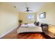 Bright bedroom with hardwood floors and large bed at 7716 Club Ln, Sarasota, FL 34238