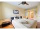 Spacious bedroom with hardwood floors and ensuite bathroom access at 7716 Club Ln, Sarasota, FL 34238