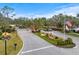 Gated entrance to the community with landscaping and flag at 7716 Club Ln, Sarasota, FL 34238