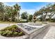 Elegant community fountain with landscaping and signage at 7716 Club Ln, Sarasota, FL 34238