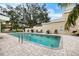 Inviting community pool with lounge chairs and patio area at 7716 Club Ln, Sarasota, FL 34238