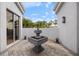 Private courtyard with fountain and brick pavers at 7716 Club Ln, Sarasota, FL 34238