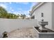 Small courtyard with fountain and brick pavers at 7716 Club Ln, Sarasota, FL 34238