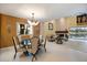 Open concept dining room with view of living room and fireplace at 7716 Club Ln, Sarasota, FL 34238