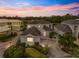 Luxury home with a tile roof and a meticulously landscaped yard at 7716 Club Ln, Sarasota, FL 34238