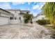 Home exterior showcasing paver driveway and landscaping at 7716 Club Ln, Sarasota, FL 34238