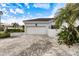 White garage door and paver driveway at 7716 Club Ln, Sarasota, FL 34238