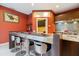 Stainless steel breakfast bar with seating in a modern kitchen at 7716 Club Ln, Sarasota, FL 34238