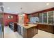 Breakfast bar with stainless steel countertop and modern pendant lighting at 7716 Club Ln, Sarasota, FL 34238