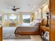 Luxurious main bedroom with lake view and ceiling fan at 7716 Club Ln, Sarasota, FL 34238