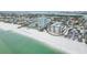 Aerial view of beachfront condo building, highlighting its location and proximity to the ocean at 800 Benjamin Franklin Dr # 602, Sarasota, FL 34236