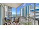 Enjoy the ocean view from this tiled balcony with seating at 800 Benjamin Franklin Dr # 602, Sarasota, FL 34236