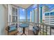 Enjoy the ocean view from this tiled balcony with comfortable seating at 800 Benjamin Franklin Dr # 602, Sarasota, FL 34236