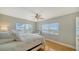 Bright bedroom with a comfortable queen-size bed and wood floors at 800 Benjamin Franklin Dr # 602, Sarasota, FL 34236