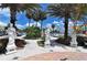 Street view of St. Armand's Circle with statues and palm trees at 800 Benjamin Franklin Dr # 602, Sarasota, FL 34236