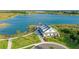 Aerial view of community clubhouse near lake at 8052 Grande Shores Dr, Sarasota, FL 34240