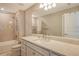 Modern bathroom with a shower/tub combo and quartz countertop at 8052 Grande Shores Dr, Sarasota, FL 34240