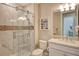 Clean bathroom with a glass shower, toilet and vanity at 8052 Grande Shores Dr, Sarasota, FL 34240