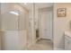 Spa-like bathroom with walk-in shower, tiled walls and bench at 8052 Grande Shores Dr, Sarasota, FL 34240