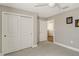 Spacious bedroom with double door closet and carpet at 8052 Grande Shores Dr, Sarasota, FL 34240