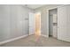 Bright bedroom with carpet flooring and double door closet at 8052 Grande Shores Dr, Sarasota, FL 34240