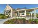 Community clubhouse with stone accents and covered porch at 8052 Grande Shores Dr, Sarasota, FL 34240