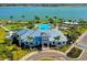 Community clubhouse with pool and lake views at 8052 Grande Shores Dr, Sarasota, FL 34240