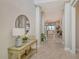 Bright and spacious entryway with console table and mirror at 8052 Grande Shores Dr, Sarasota, FL 34240