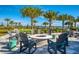 Relaxing fire pit area with seating overlooking the lake at 8052 Grande Shores Dr, Sarasota, FL 34240