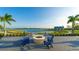 Fire pit area with seating overlooking lake at 8052 Grande Shores Dr, Sarasota, FL 34240