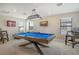 Game room with pool table, seating, and a TV at 8052 Grande Shores Dr, Sarasota, FL 34240