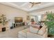 Bright living room featuring a sectional sofa and large TV at 8052 Grande Shores Dr, Sarasota, FL 34240