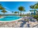 Inviting pool area with tables and chairs at 8052 Grande Shores Dr, Sarasota, FL 34240