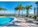 Expansive pool deck with lounge chairs and umbrellas at 8052 Grande Shores Dr, Sarasota, FL 34240