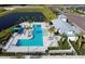 Aerial view of community pool, clubhouse, and landscape at 8307 Trimbelle Ter, Parrish, FL 34219