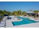 Resort-style pool with lounge chairs and cabanas at 8307 Trimbelle Ter, Parrish, FL 34219