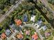 Aerial view of neighborhood with houses and waterway at 8628 Woodbriar Dr, Sarasota, FL 34238