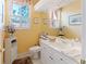 Bright bathroom with updated vanity and large mirror at 8628 Woodbriar Dr, Sarasota, FL 34238