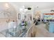 Spacious dining area with glass table and views into Gathering room and kitchen at 8628 Woodbriar Dr, Sarasota, FL 34238