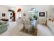 Formal dining room featuring a glass-top table and chandelier at 8628 Woodbriar Dr, Sarasota, FL 34238