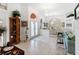 Bright and airy entryway with tile floors and views into the dining and living areas at 8628 Woodbriar Dr, Sarasota, FL 34238