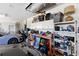 Organized garage with shelving and workbench at 8628 Woodbriar Dr, Sarasota, FL 34238