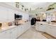 Clean lines and white cabinetry define this eat-in kitchen at 8628 Woodbriar Dr, Sarasota, FL 34238