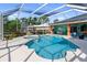 Inviting pool area with spa and screened enclosure at 8628 Woodbriar Dr, Sarasota, FL 34238