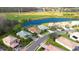 Aerial view of single-Gathering home on a golf course community with a pond at 8752 Monterey Bay Loop, Bradenton, FL 34212