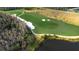 Aerial view of golf course with a lake at 8752 Monterey Bay Loop, Bradenton, FL 34212