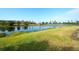 Landscaped backyard with pond and lush greenery at 8752 Monterey Bay Loop, Bradenton, FL 34212