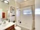 Clean bathroom with shower/tub combo and wood vanity at 8752 Monterey Bay Loop, Bradenton, FL 34212